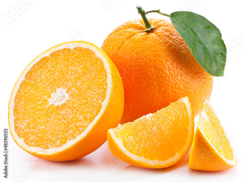 Photo: Orange with leaf on a white background. Orange with leaf on a white background.