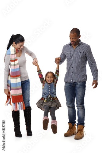 Photo: Mixed race family with cute little girl walking Mixed race family with cute little girl walking