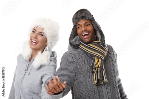 Photo: Happy couple laughing hand in hand Happy couple laughing hand in hand