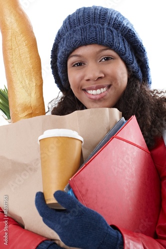 Photo: Smiling afro woman overloaded Smiling afro woman overloaded