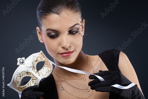 Photo: Smart woman with carnival mask Smart woman with carnival mask