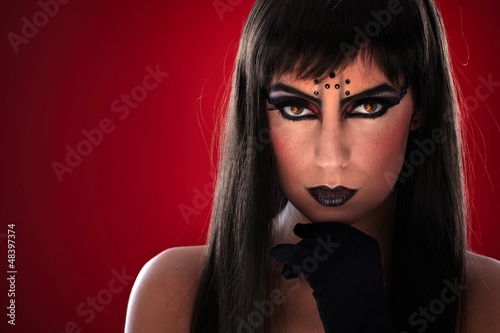 Photo: Young woman with black makeup Young woman with black makeup