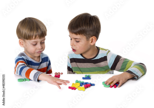 Photo: boys playing with rubber lettters boys playing with rubber lettters