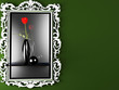 a red rose in the dark vase