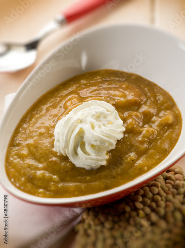 Photo: lentils cream soup with yogurt cream, selective focus lentils cream soup with yogurt cream, selective focus
