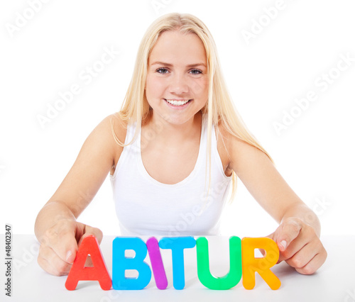 Photo: Attraktive junge Frau bildet den Begriff Abitur Attraktive junge Frau bildet den Begriff Abitur