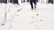 Jogger running through deep snow in forest