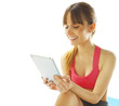 Foto: young fitness woman with a digital tablet young fitness woman with a digital tablet