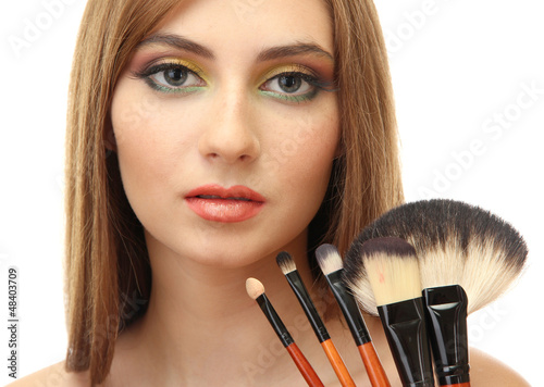 Photo: portrait of beautiful woman with make-up brushes, isolated portrait of beautiful woman with make-up brushes, isolated