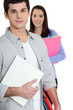 Students holding folders