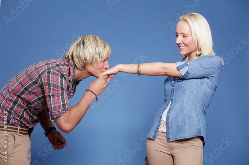 Photo: Man kissing woman's hand. Man kissing woman's hand.