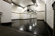 Old underground tunnel illuminated with neon