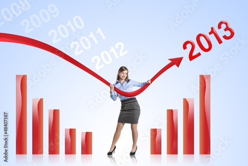 Photo: Woman with statistics curve Woman with statistics curve