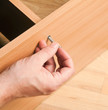 Carpenter mounting wooden furniture