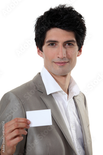 Photo: Businessman holding business card Businessman holding business card