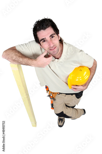 Photo: woodworker leaning on a board woodworker leaning on a board