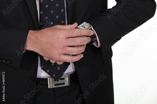 Photo: Businessman looking at the time Businessman looking at the time