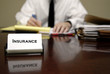 Insurance Man Sitting at Desk