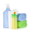 Shampoo and gel bottles with towels and flower