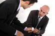 Businessmen exchanging cards