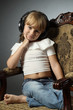 Beautiful girl listening to music on headphone