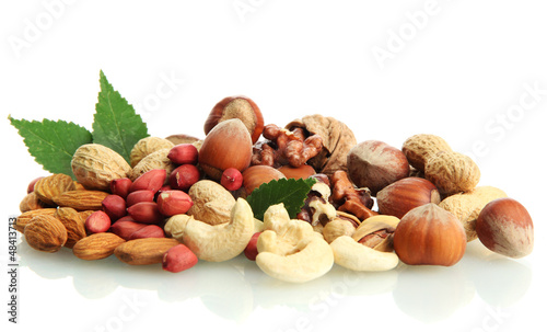 Photo: assortment of tasty nuts with leaves, isolated on white assortment of tasty nuts with leaves, isolated on white