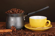 Coffee maker with yellow cup on wooden table