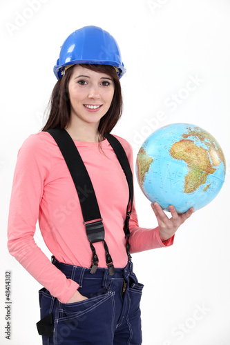 Photo: craftswoman holding a globe craftswoman holding a globe