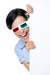 Spectator in 3D glasses peeps out from behind the copyspace