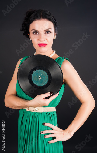 Photo: Pretty girl holding vinyl disc Pretty girl holding vinyl disc