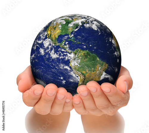 Photo: Woman holding globe on her hands, South and North America Woman holding globe on her hands, South and North America