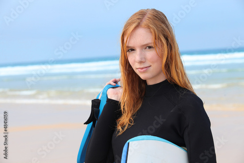 Photo: Redhead girl with surfboard Redhead girl with surfboard