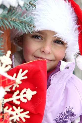 Photo: Little girl in a Santa hat Little girl in a Santa hat