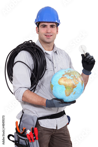 Photo: craftsman holding a bulb and a globe craftsman holding a bulb and a globe