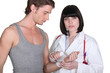 Doctor wrapping gauze around a patient's wrist