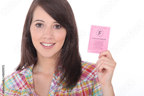 Photo: Brunette with a driving license Brunette with a driving license