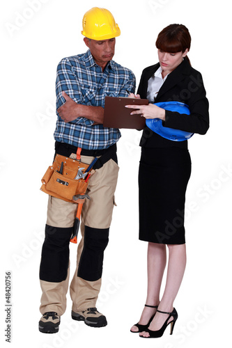 Photo: Engineer signing a form Engineer signing a form
