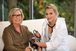 doctor examining a senior woman