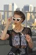 Portrait of model in designer clothes and sunglasses