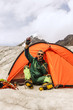 The climber in mountain camp in tent