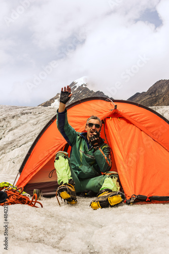 Photo: The climber in mountain camp in tent The climber in mountain camp in tent