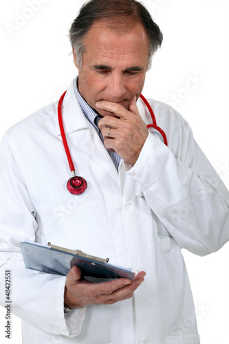 Photo: Doctor with a stethoscope and clipboard Doctor with a stethoscope and clipboard