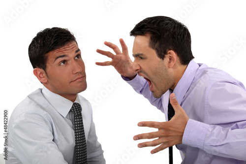 Photo: Businessman shouting at a colleague Businessman shouting at a colleague