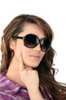 Woman wearing oversized sunglasses
