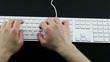 Typing on the white laptop Keyboard