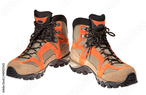 Photo: Hiking boots on the white background Hiking boots on the white background
