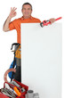 plumber OK sign behind wall