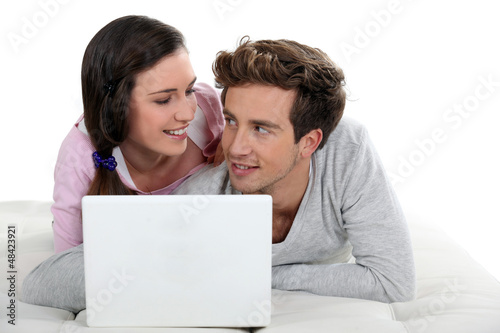 Photo: Couple surfing the internet Couple surfing the internet