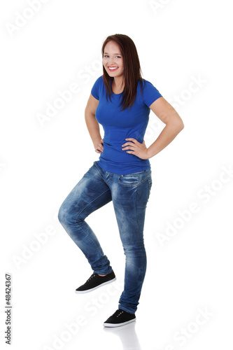 Photo: Happy casual woman with one leg up Happy casual woman with one leg up