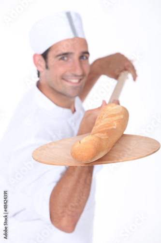 Photo: baker baking bread baker baking bread